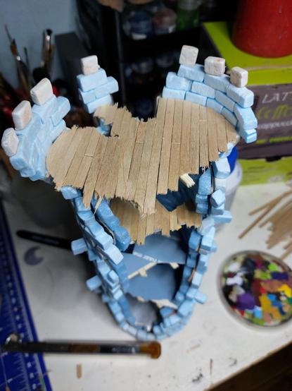 That same tower but now viewed from the top with a view on two of the panelled floors showing how I made my life weird and uncomfortable by not putting coffee stirrers on every floor level already when inserting the cardboard circles