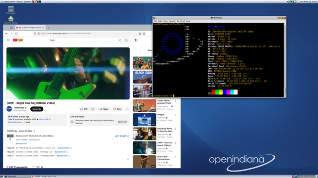 Screenshot of an openindiana desktop, with an open Firefox playing a music video from TWRP and a terminal showing the system specs.