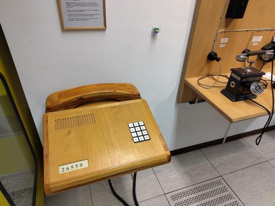 A huge telephone made of wood
