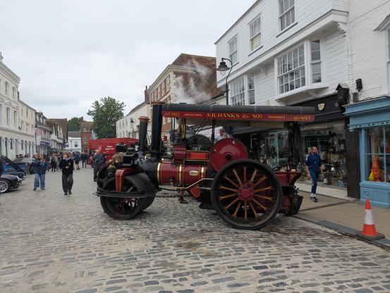 A photo of Faversham market place showing a splendid old agricultural traction engine.