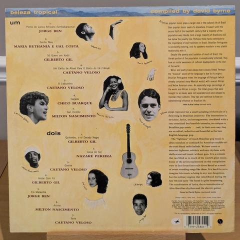 back cover with headshots of musicians and the start of liner notes, continued on inner sleeve