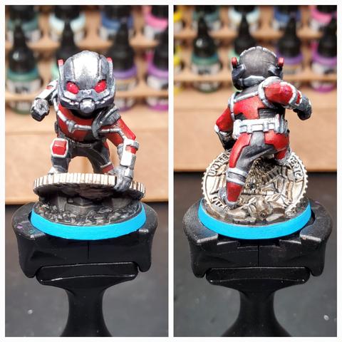 Collaged photos of the front and back of a painted Ant-Man miniature perched atop a Citadel pain handle.