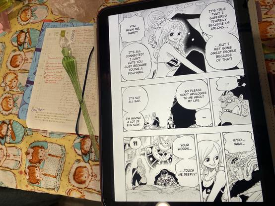 One Piece hobonichi open to the 5/18 page underneath an iPad displaying manga