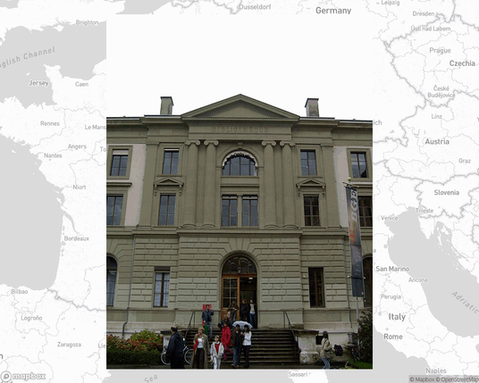 A photo of or from a library from the linked website, overlaid on a cropped world map where it's located.