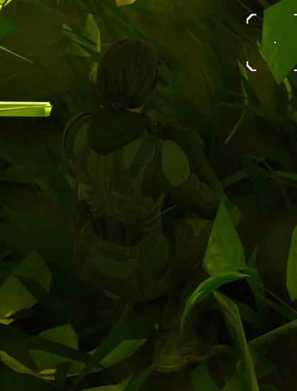 Close-up of the back of a thin woman wearing clothes that blend in with the bush she is kneeling in.