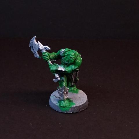 An orc from HeroQuest. He has just some base coloring done. Green for skin, silver for armor and weapon.