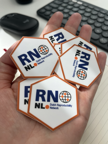 Picture of a hand holding hex stickers