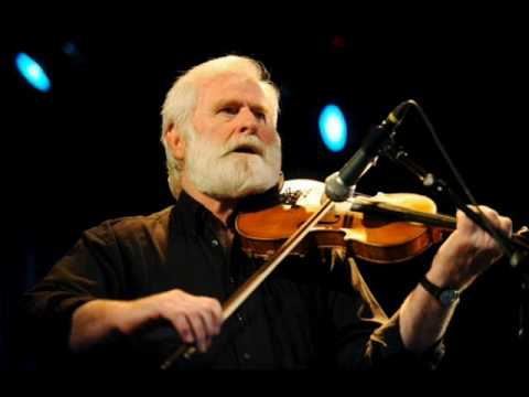 John Sheahan playing a fiddle.