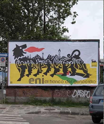 Logo Eni, poster 6 metri x 3 metri
ENI AL FIANCO DEL GENOCIDIO