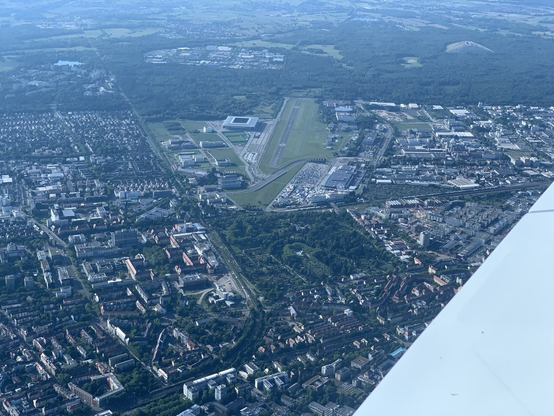 The Freiburg Airfield in the centre of the image, surrounded by the city to the south and some forest to the north. Seen from climb out via the tragic circuit.