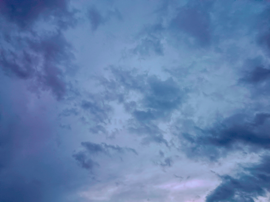 Fluffy spring clouds, bright evening sky