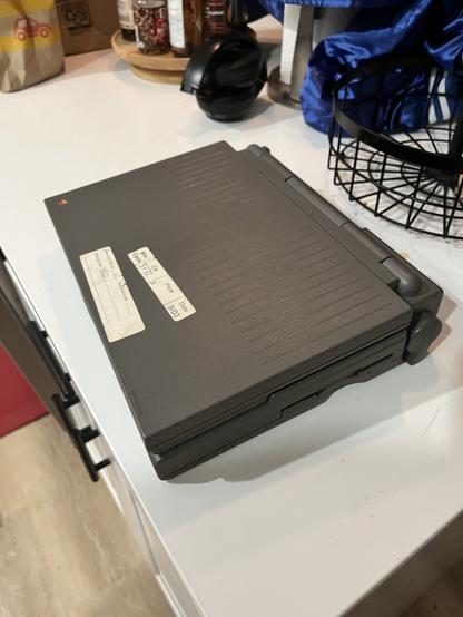 Dark grey PowerBook 160 closed