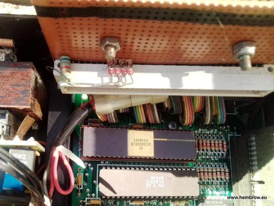 Some veroboard near the lovely ceramic 68008 contains a socket for the expansion boards. Next to the socket you'll see some germanium diodes (recycled from a 1960s Burroughs computer board!) and a resistor. These provide a write signal for the plug in ROM socket on the computer, which doesn't normally allow writing.