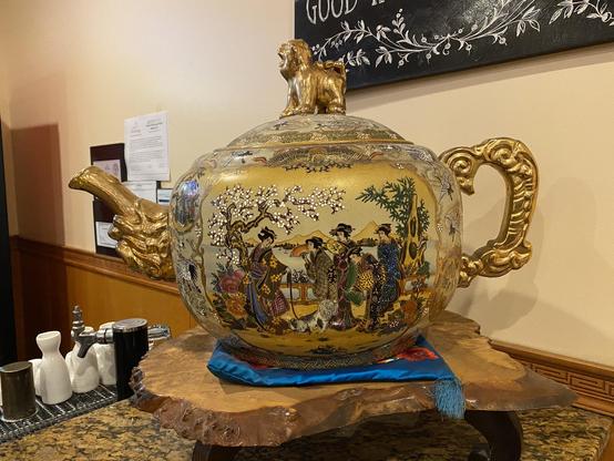The teapot is intricate and ornate.