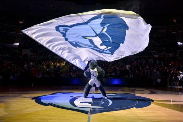<strong>Grizz, the Memphis Grizzlies mascot, waves a flag before an NBA basketball game against the Houston Rockets Saturday, Oct. 28, 2017, in Memphis, Tenn.</strong> (AP Photo/Brandon Dill)