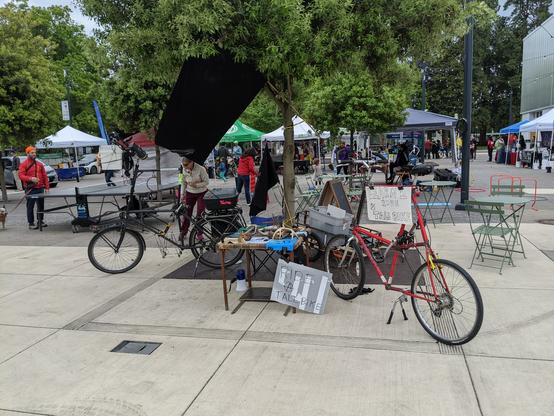 Picture of the table and tall bike for the critcal mass tall bike school
