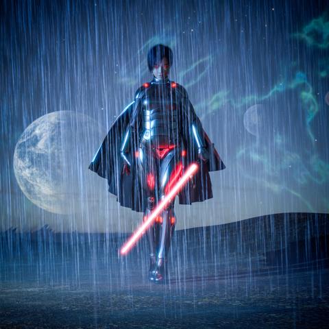 description by GPT4All: A futuristic warrior walks forward in heavy rain, glowing with red and blue lights. The figure is wearing sleek metallic armor with illuminated joints and accents, and a black cape drapes over their shoulders. Their eyes emit a red glow, giving them an intense, determined expression. In their right hand, they hold a bright red lightsaber angled downward, casting light on the wet ground. The scene takes place under a dramatic night sky with a large, bright moon and distant planets visible through the rain. Lightning-like green auroras ripple across the sky, adding an otherworldly energy to the dark landscape.