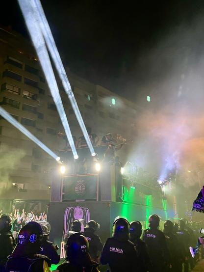 Sporting Clube de Portugal bus passing in the night with the team players on top