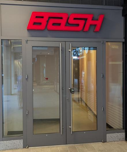 Storefront with BASH written above the doors.