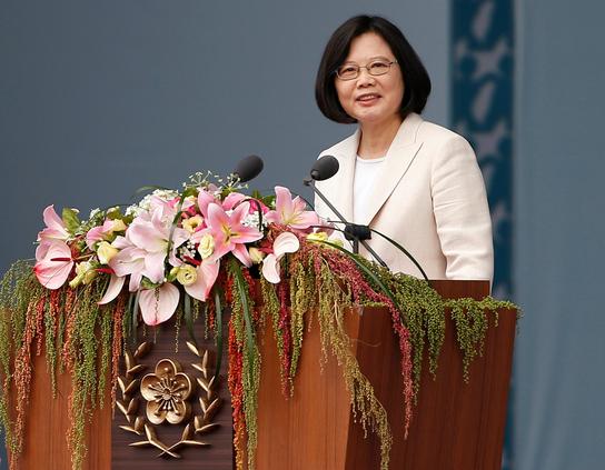 Tsai Ing-wen at her first inauguration. She is a Taiwanese woman with straight black hair in a bob.