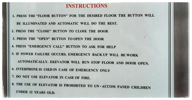 Sign in a lift with instructions how to use it.