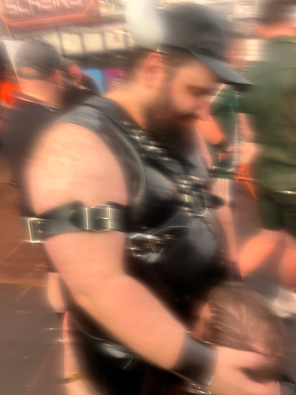 a photo of lthbearsolid holding my face into his rubber clad belly so i cant breath.
