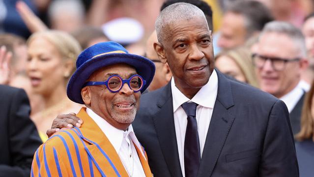 US director and executive producer Spike Lee and US actor Denzel Washington arrive for the screening of the film Highest 2 Lowest at the 78th edition of the Cannes Film Festival in Cannes, southern France, on May 19, 2025.