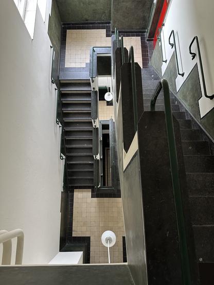 An art deco staircase inside the main building