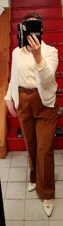 Butter yellow button up, mocha trousers, white lacy cardigan, churchy-looking white slingbacks with dumb bows.