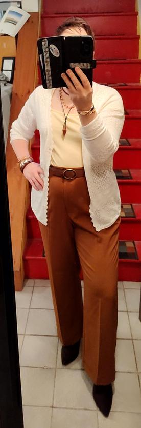 Butter yellow sweetheart neck T, mocha trousers and belt, chocolate kitten heel boots, spiky necklaces, bangle bracelets.