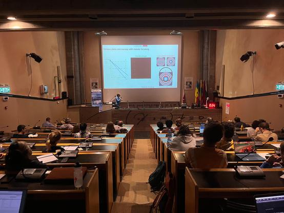 An image of me presenting a slide about oblique plane microscopy in front of the school audience