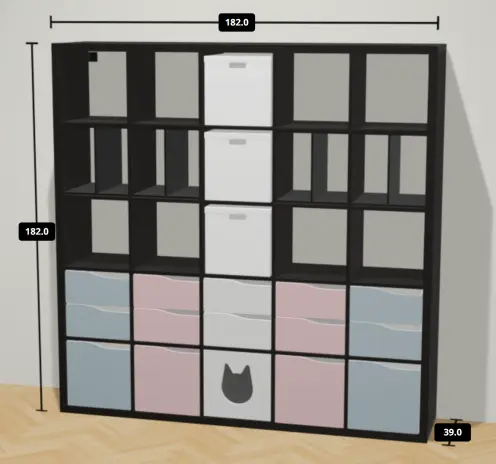 A black 5x5 Kallax frame with inserts in the colours of the trans flag along the bottom two rows (light blue, pink, white, pink, light blue), including a kitty cubby (in the middle), three white storage boxes (down the center line from the top) and four vertical dividers (along the second row from the top).