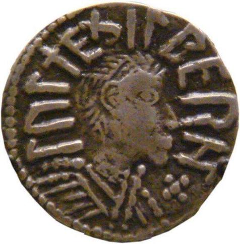 Coin with the king's head in a simple style on it.