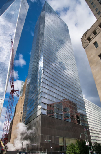 Looking up at 7WTC - Seven World Trade Center. On the left (diagonally across the street) is partially seen One World Trade or the World Trade Center Tower.