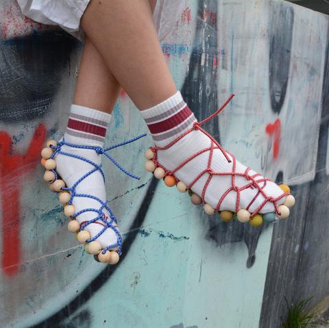 Pictures of feet wearing modular shoes