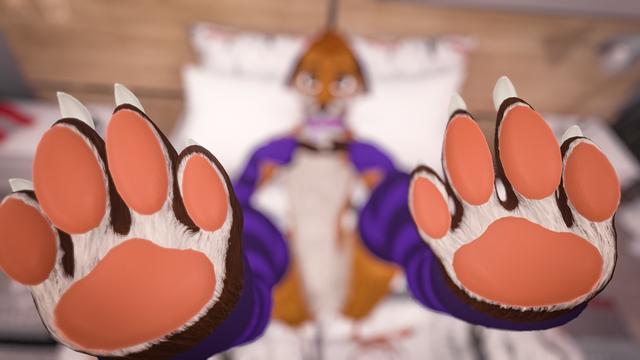 Photo taken in VR of me lying in a bed with my paws in the air close up to the pov of the viewer.