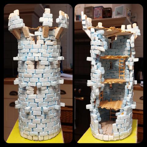Ruined tower with partially damaged floors visible. There are ladders, I repeat ladders and definitely no spiral staircases, on the inside and the top floor has lost some battlements.