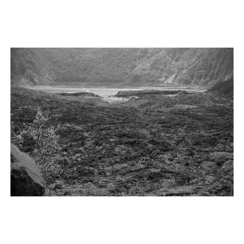 view across cooled lava lake ay bottom of volcanic crater