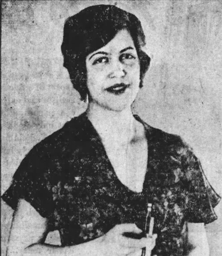Ilza Niemack, from a 1930 newspaper; a white woman with short dark hair, wearing a dark dress with a v-neckline and short sleeves