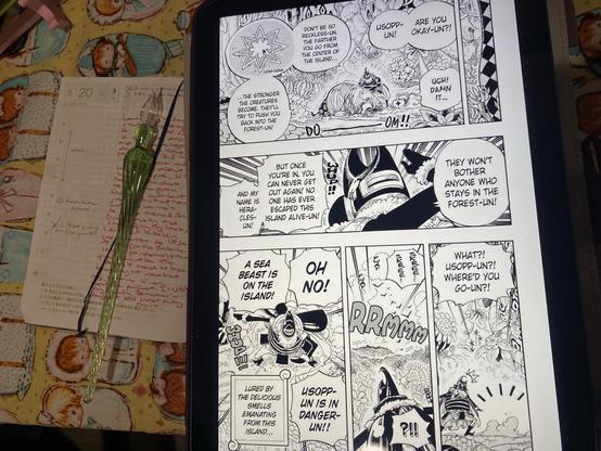 One Piece hobonichi open to the May 20 page underneath an iPad displaying manga