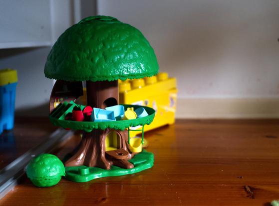 A child's treehouse toy, left abandoned in a now-empty house