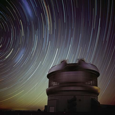 2006 September 1

Gemini South Star Trails
 * Credit & Copyright: Elke Schulz

Explanation: 
Stars seem to arc through southern skies in this surrealistic time exposure -- recorded before moonrise from the Gemini South Observatory, Cerro Pachon, Chile, Planet Earth. During the one hour 40 minute exposure camera and tripod were fixed, so the concentric star trails are a reflection of Earth's daily rotation about its axis. The view looks to the south and includes the Gemini telescope enclosure in the foreground. At the apparent center of the curving trails, the South Celestial Pole lies just off the upper left edge. Two faint, wide streaks track the Magellanic Clouds, satellites of the Milky Way Galaxy, while a meteor flashes throught the scene just left of the observatory. 

Authors & editors: Robert Nemiroff (MTU) & Jerry Bonnell (USRA)
NASA Web Site Statements, Warnings, and Disclaimers
NASA Official: Phil Newman Specific rights apply.
A service of: ASD at NASA / GSFC
& Michigan Tech. U.