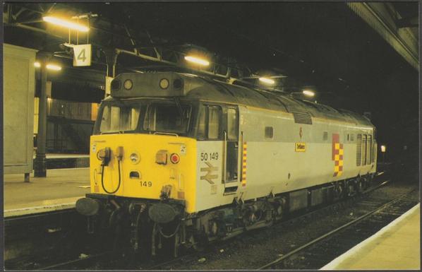 Printed colour postcard showing a view of British Rail Railfreight Class 50 No 50149 'Defiance' at Exeter St Davids station on 14 November 1988.

Published by Dawlish Warren Postcards, Exe Rail, Series 2 No 38 (C10946X).

Postally unused.

Excellent condition.