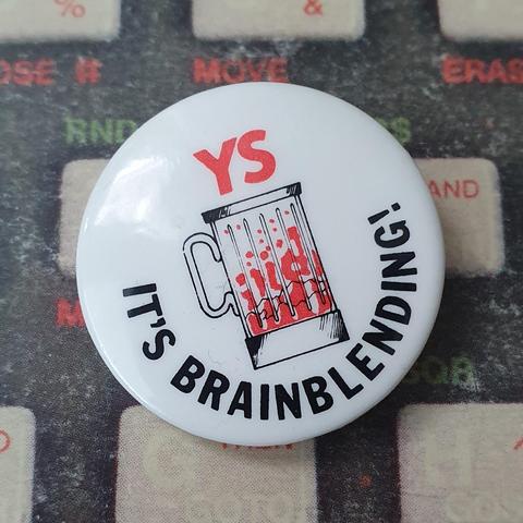 Small white pin button with the text "YS - It's Brainblending!" and a drawing of a blender with red goo in it.