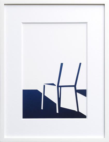collage where you see the shadow part of a chair and the shadow on the floor. The rest of the image is white. There is very little information but you do recognize a chair. The collage is framed in a white wooden frame with a white passe partout.