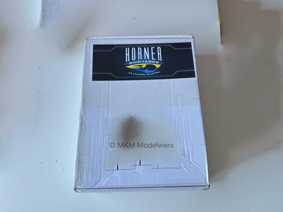 A white box with the name and logo of Horner Shipyards on it. The address has been edited out.