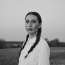 Picture of Ken Pomeroy with braids and a white shirt.