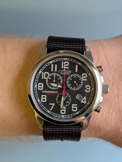 A Citizen Eco-Drive Chronograph with a black face.