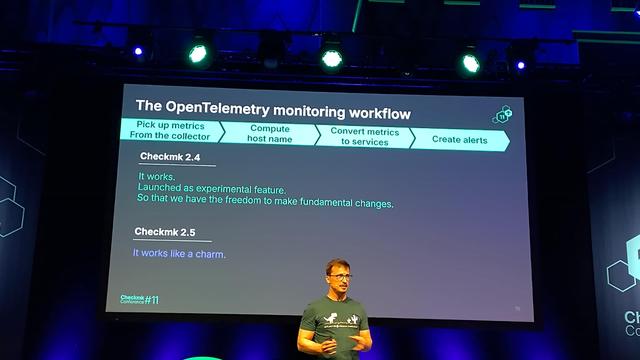 A presentation slide showing the current status of OpenTelemetry in Checkmk.

Lars Michelsen on stage in front of it.