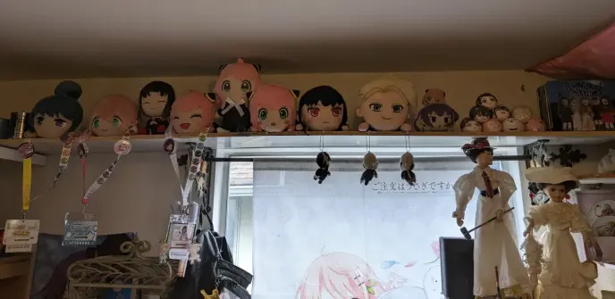 A line of SpyXFamily and Yuru Camp plushies.